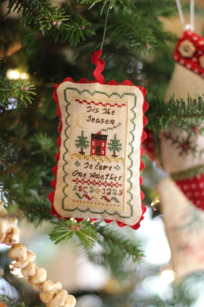 Our tree is decorated with handmade ornaments. This is from a dear friend. Cross stitched on linen.